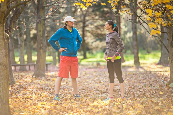 Man and female training outside during autumn day. — Stock Photo, Image