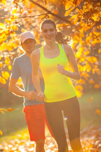Man and female training outside during autumn day. — Stock Photo, Image