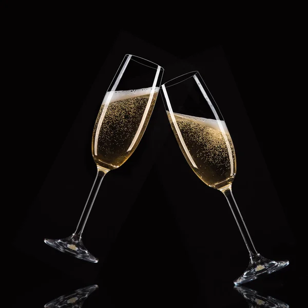Glasses of champagne with splash, celebration theme. — Stock Photo, Image