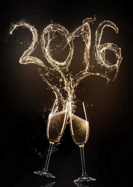 Glasses of champagne with splash, celebration theme. — Stock Photo, Image