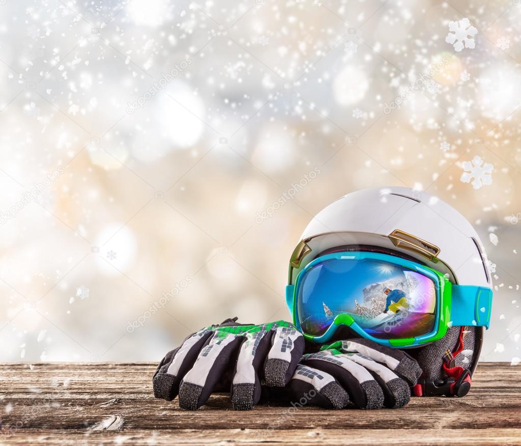 Colorful ski glasses, gloves and helmet