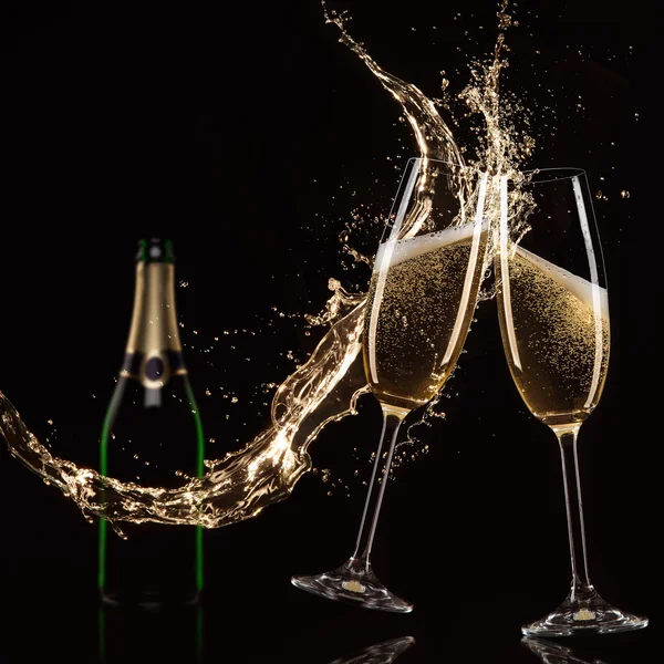 Glasses of champagne with splash — Stock Photo, Image