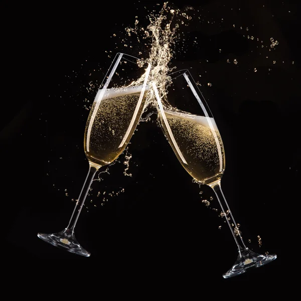 Szklanki szampana z splash — Zdjęcie stockowe