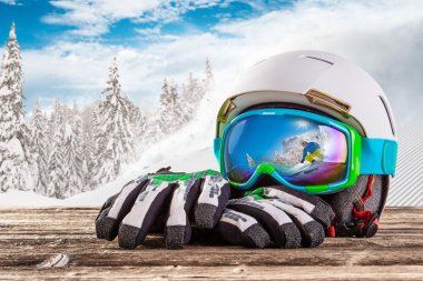Colorful ski glasses, gloves and helmet clipart