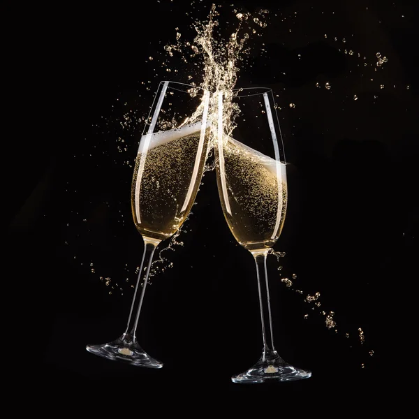 Glasses of champagne with splash — Stock Photo, Image