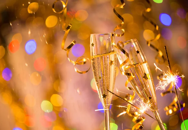 Glasses of champagne with bright gold background — Stock Photo, Image