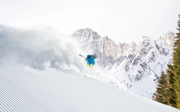 Skier skiing downhill in high mountains — Stock Photo, Image