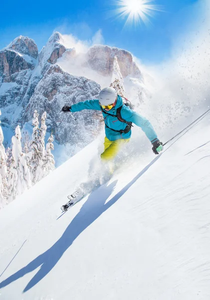 Skier skiing downhill in high mountains — Stock Photo, Image