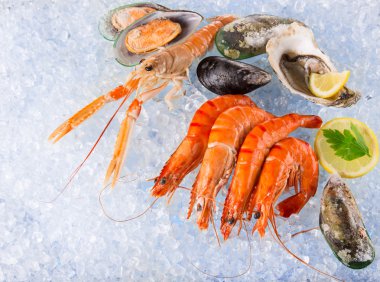 Fresh seafood on crushed ice. clipart