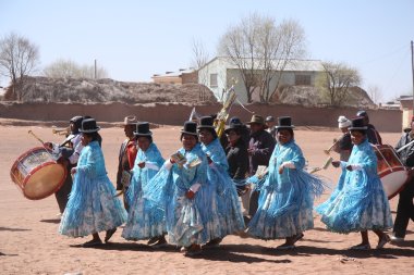 People dance during the holiday in a village of Bolivia clipart