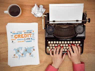 Hands typing on a Vintage typewriter. paper with business concept on table clipart
