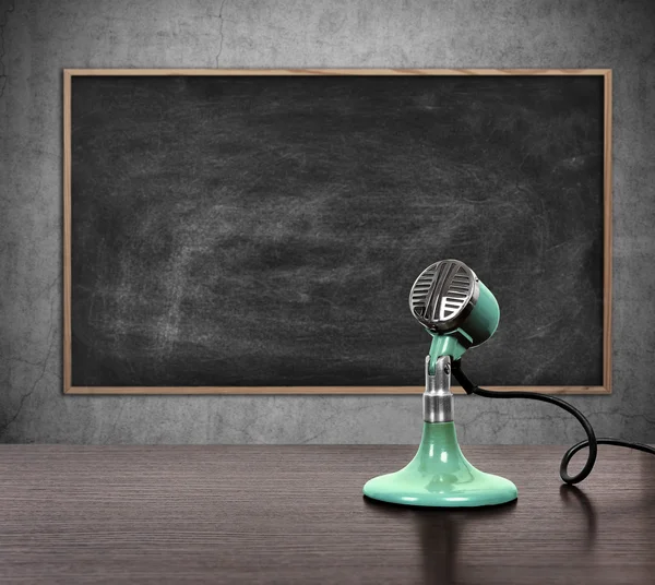 Vintage microphone and blank blackboard — Stock Photo, Image