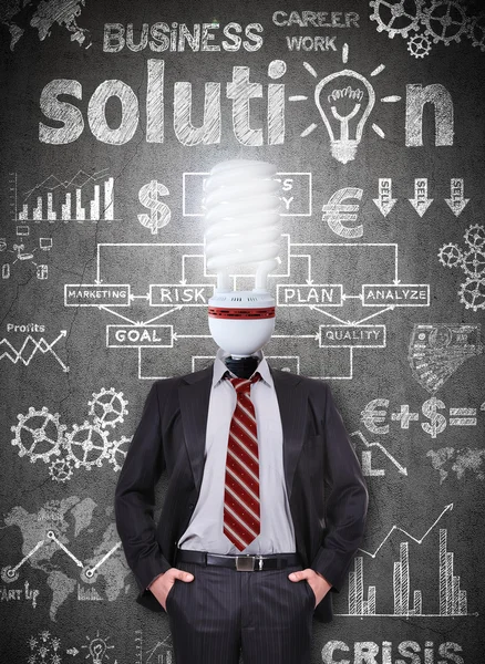 Businessman with head energy saving bulb — Stock Photo, Image