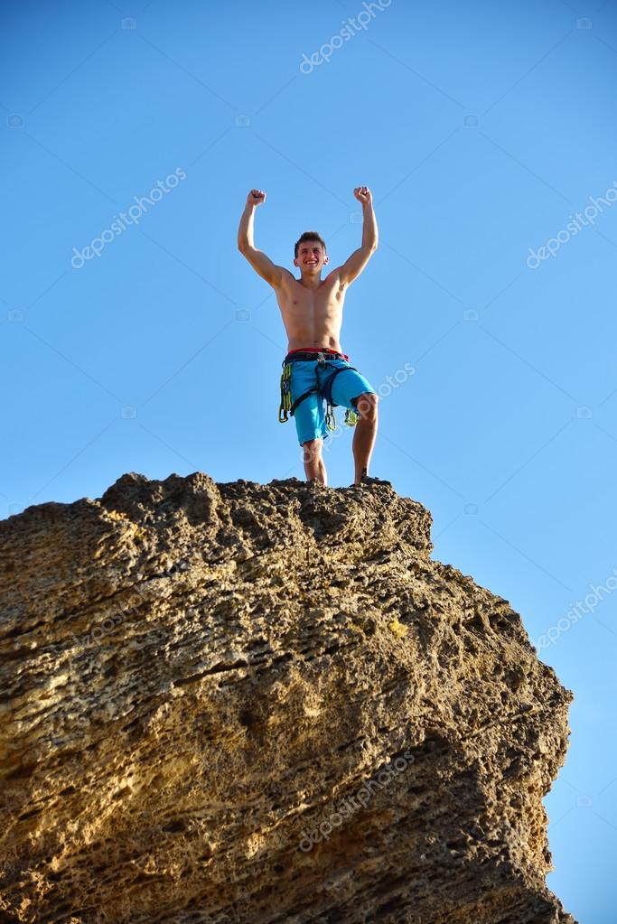 Extreme Climber Raising Hands Stock Photo by ©vetkit 116048076