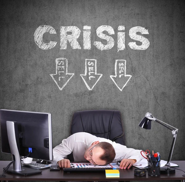 Tired businessman sitting in office, crisis concept — Stock Photo, Image