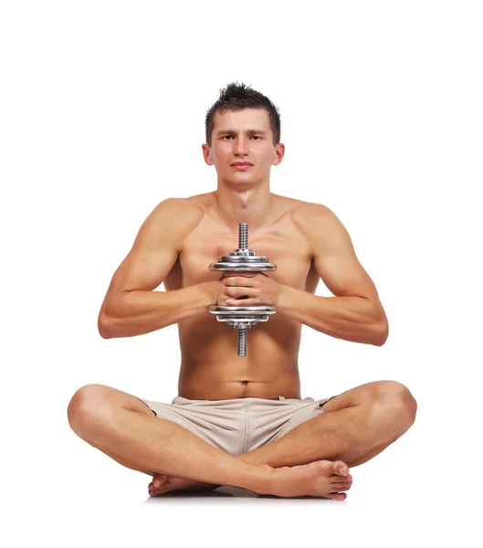 Bodybuilder sitting with dumbbell — Stock Photo, Image