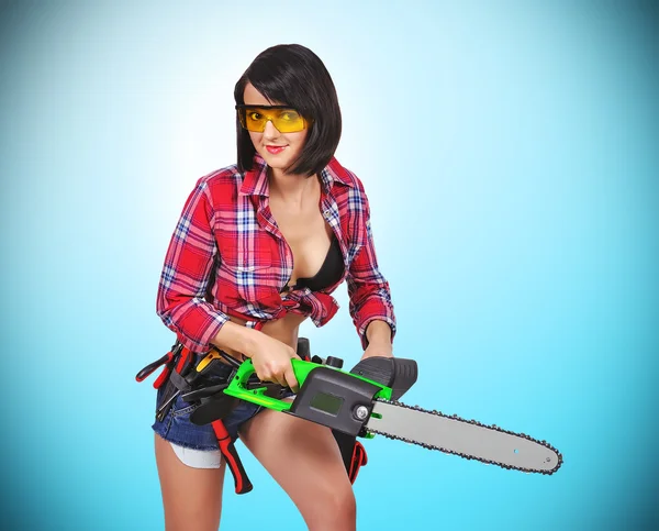 Girl with electric saw — Stock Photo, Image