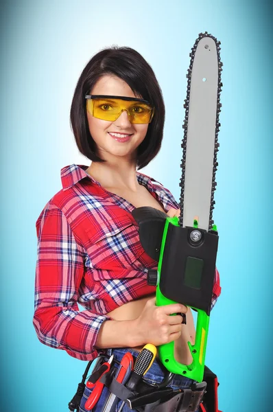 Girl with chainsaw — Stock Photo, Image