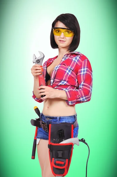 Sexy girl with wrench — Stock Photo, Image