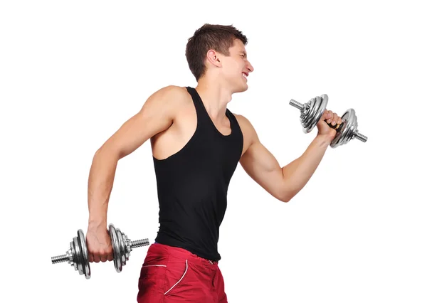 Muscular man lifting dumbbells — Stock Photo, Image