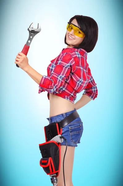 Girl with wrench — Stock Photo, Image
