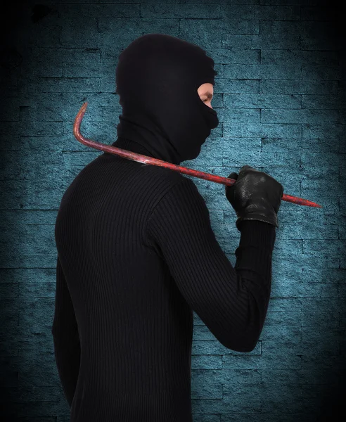 Mugger in mask with nail puller — Stock Photo, Image