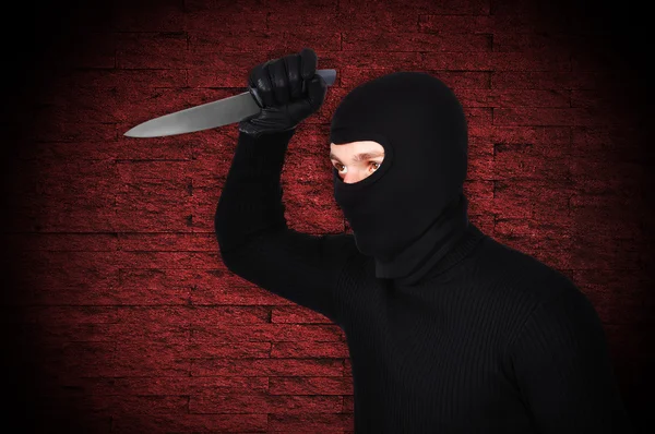 Man in mask with knife — Stock Photo, Image