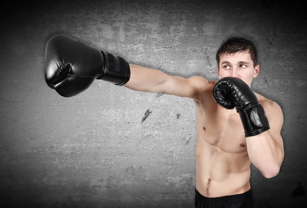 Człowieka, ćwiczenia w Rękawice bokserskie — Zdjęcie stockowe