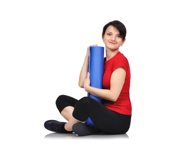 Girl sitting with mat — Stock Photo, Image