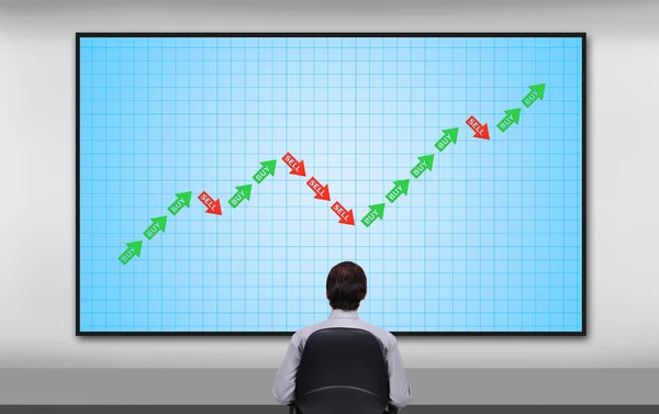 Affärsmannen ser till diagram — Stockfoto