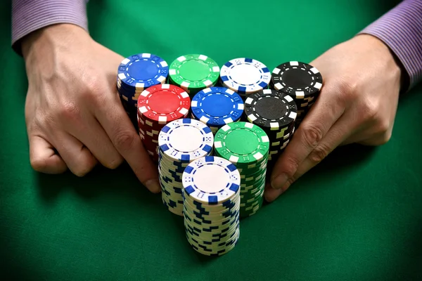 Dealer moves poker chips — Stock Photo, Image