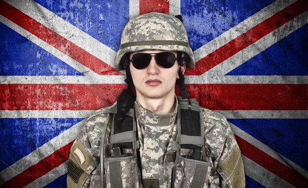 Soldier and england flag — Stock Photo, Image