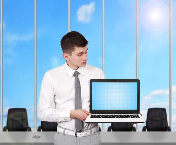 Businessman holding laptop — Stock Photo, Image