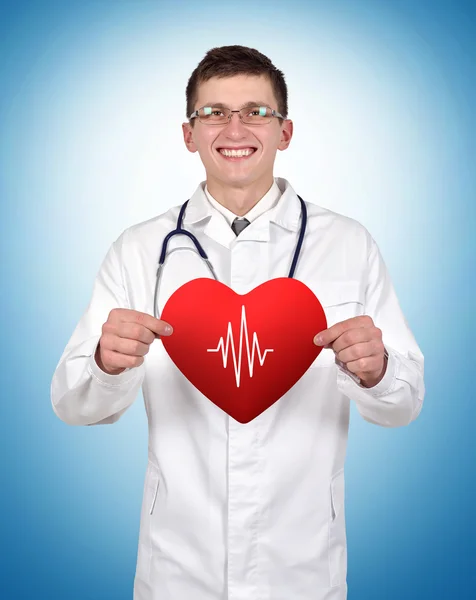 Doctor holding heart with pulse Royalty Free Stock Photos