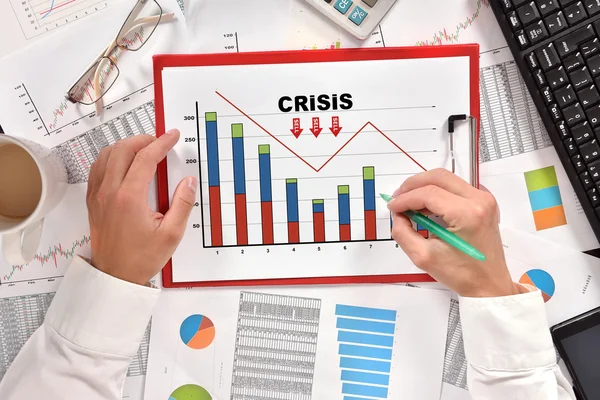 Business man drawing crisis chart — стоковое фото