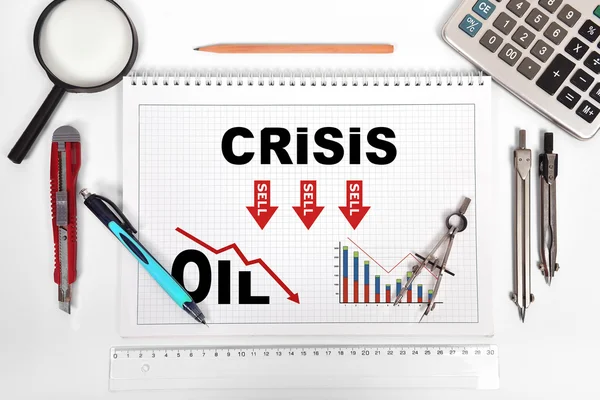 石油危機グラフとメモ帳 — ストック写真