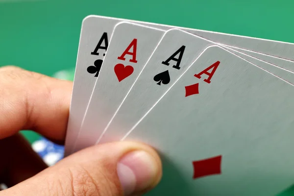 Hand holding four aces — Stock Photo, Image