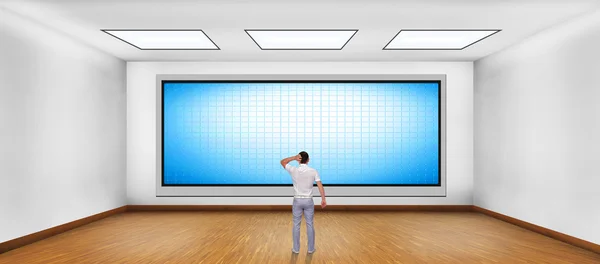 businessman looking at blank plasma tv