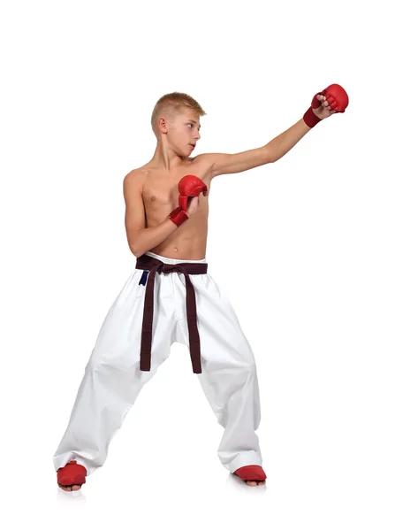 年轻的男孩正在做空手道拳 — 图库照片
