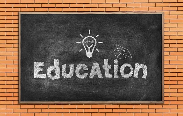 Blackboard with drawing education symbol — Stock Photo, Image