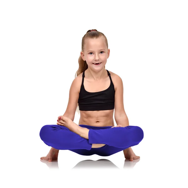 Happy girl in blue clothing sitting lotus position — Stock Photo, Image