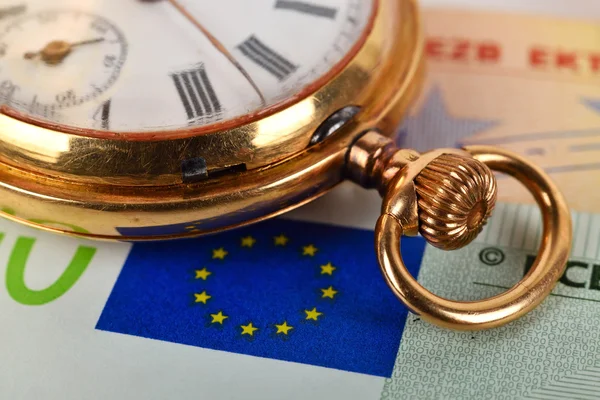 Euro bills and pocket watch — Stock Photo, Image