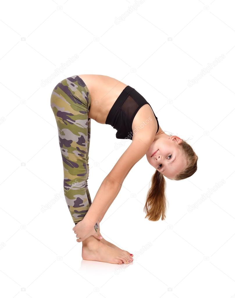 Active little girl doing yoga Stock Photo by ©vetkit 89951738