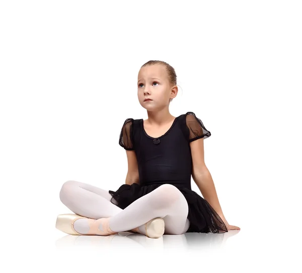 Ballerina kig sitting on floor — Stock Photo, Image