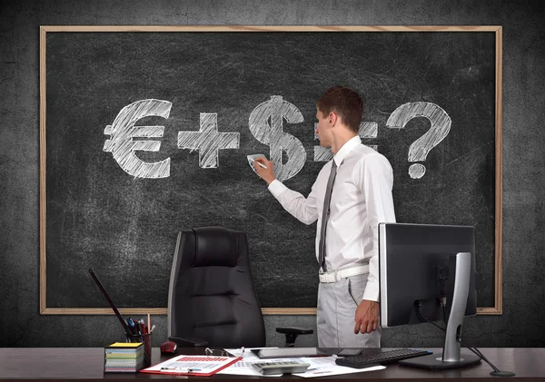 Businessman drawing money formula — Stock Photo, Image