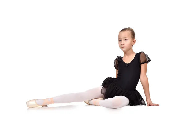 Girl ballerina sitting on floor — Stock Photo, Image