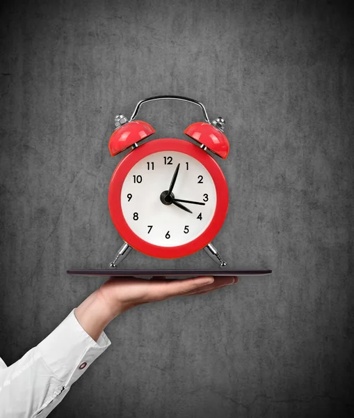 Tablet and alarm clock — Stock Photo, Image