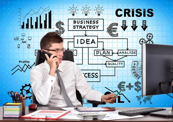 Businessman sitting in office with phone — Stock Photo, Image