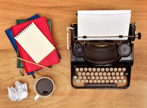 Vintage typewriter. Cup, pencil and notebooks — Stock Photo, Image