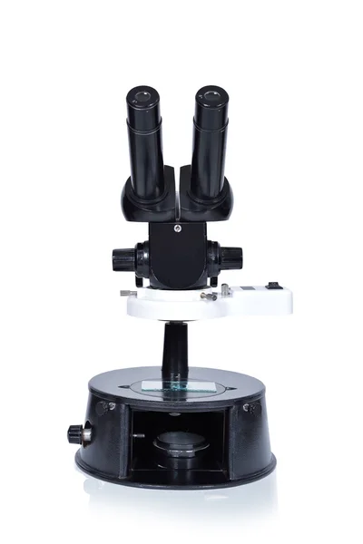 Old microscope on a white background — Stock Photo, Image